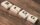 Scrabble tiles spelling 'BLOG' on a wooden background, symbolizing creativity and writing.
